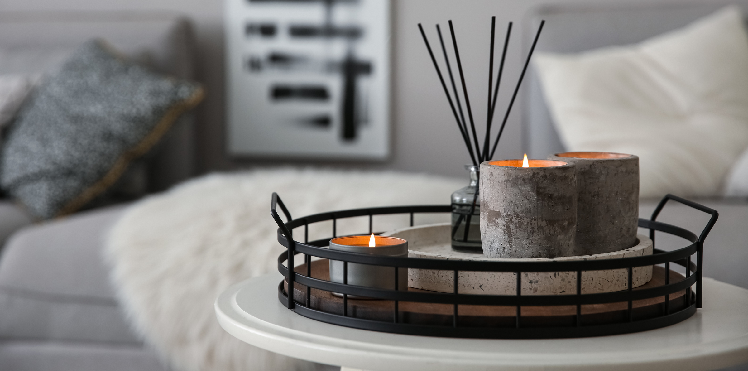 reed diffuser on tray with candles