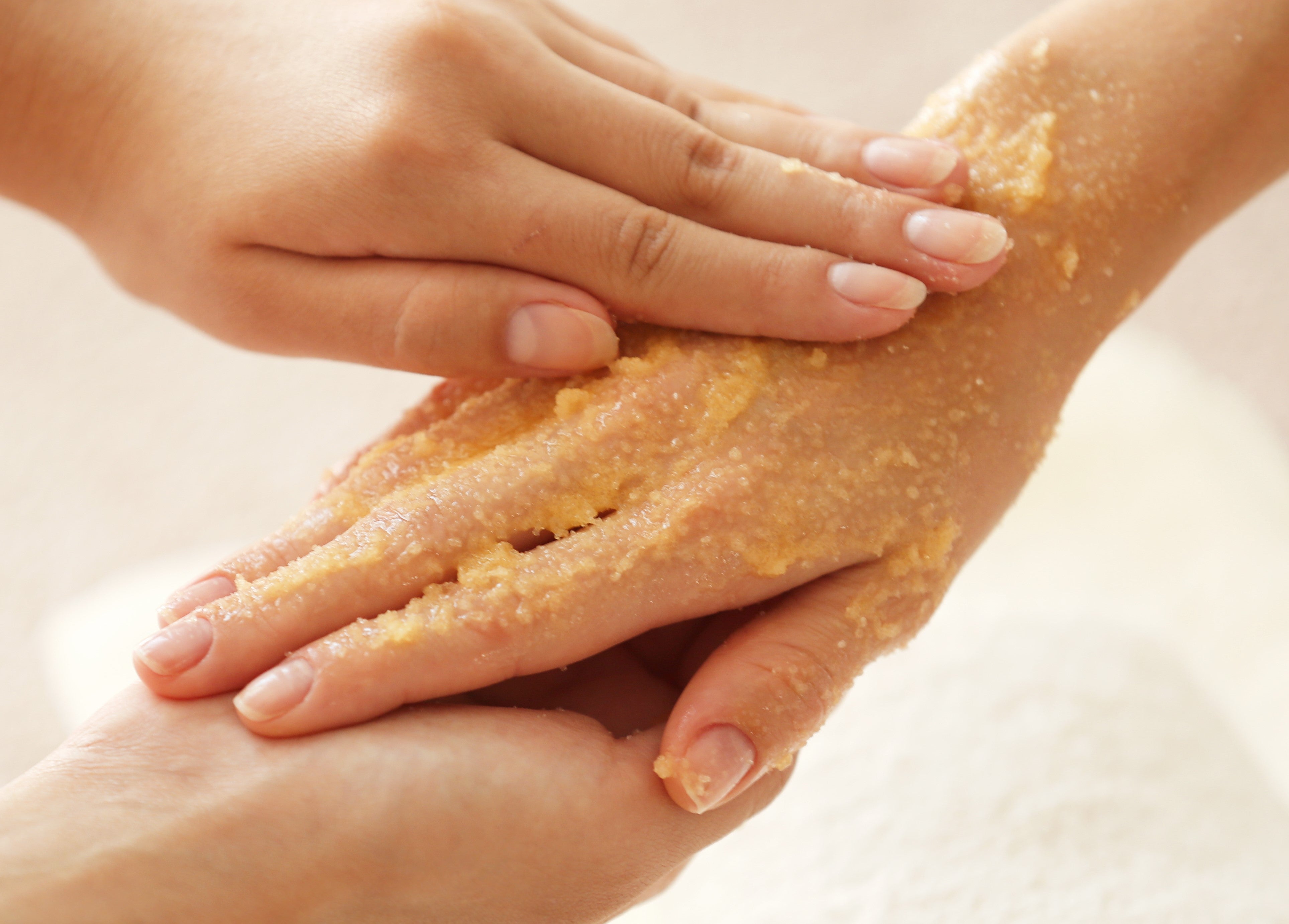 beautiful hands massaged with a salt scrub